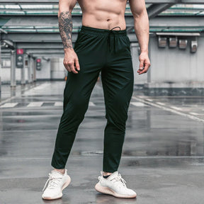 Calça de corrida masculina, calça esportiva, calça com cintura elástica, calça de poliéster e spandex, calça para treino, calça ajustada para corrida, moda fitness masculina, calça SHEDAO, calça de alta performance