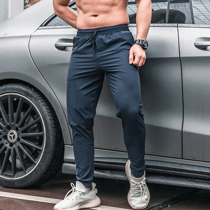 Calça de corrida masculina, calça esportiva, calça com cintura elástica, calça de poliéster e spandex, calça para treino, calça ajustada para corrida, moda fitness masculina, calça SHEDAO, calça de alta performance