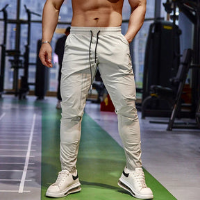 Calça de corrida masculina, calça esportiva, calça com cintura elástica, calça de poliéster e spandex, calça para treino, calça ajustada para corrida, moda fitness masculina, calça SHEDAO, calça de alta performance