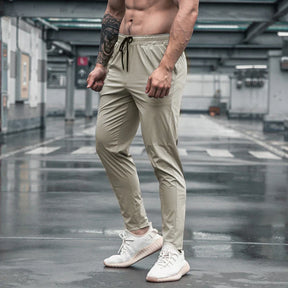 Calça de corrida masculina, calça esportiva, calça com cintura elástica, calça de poliéster e spandex, calça para treino, calça ajustada para corrida, moda fitness masculina, calça SHEDAO, calça de alta performance